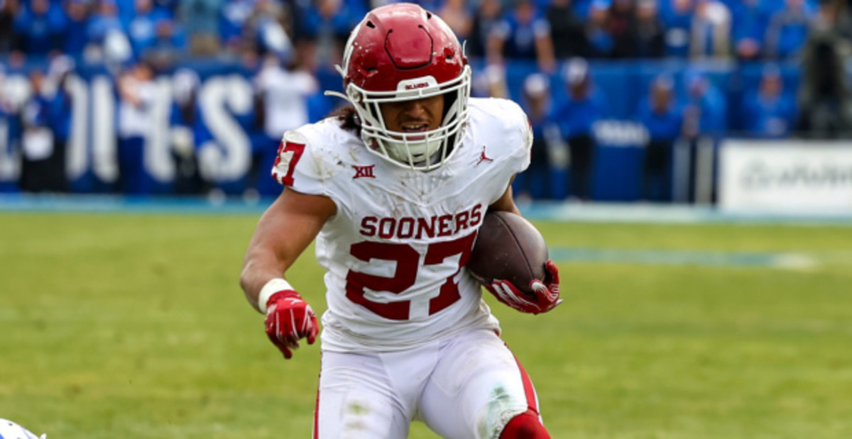 Oklahoma Sooners tailback Gavin Sawchuk on a rushing attempt during a college football game in the SEC.