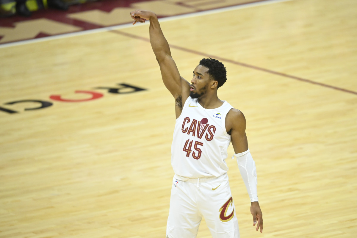 Feb 5, 2024; Cleveland, Ohio, USA; Cleveland Cavaliers guard Donovan Mitchell (45) watches his three-point basket in the third quarter against the Sacramento Kings at Rocket Mortgage FieldHouse.