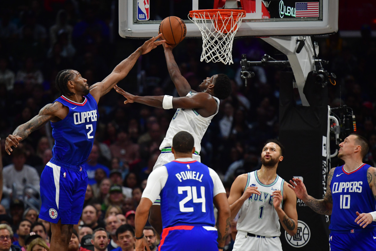 Feb 12, 2024; Los Angeles, California, USA; Minnesota Timberwolves guard Anthony Edwards (5) moves to the basket against the defense of Los Angeles Clippers forward Kawhi Leonard (2) during the second half at Crypto.com Arena.
