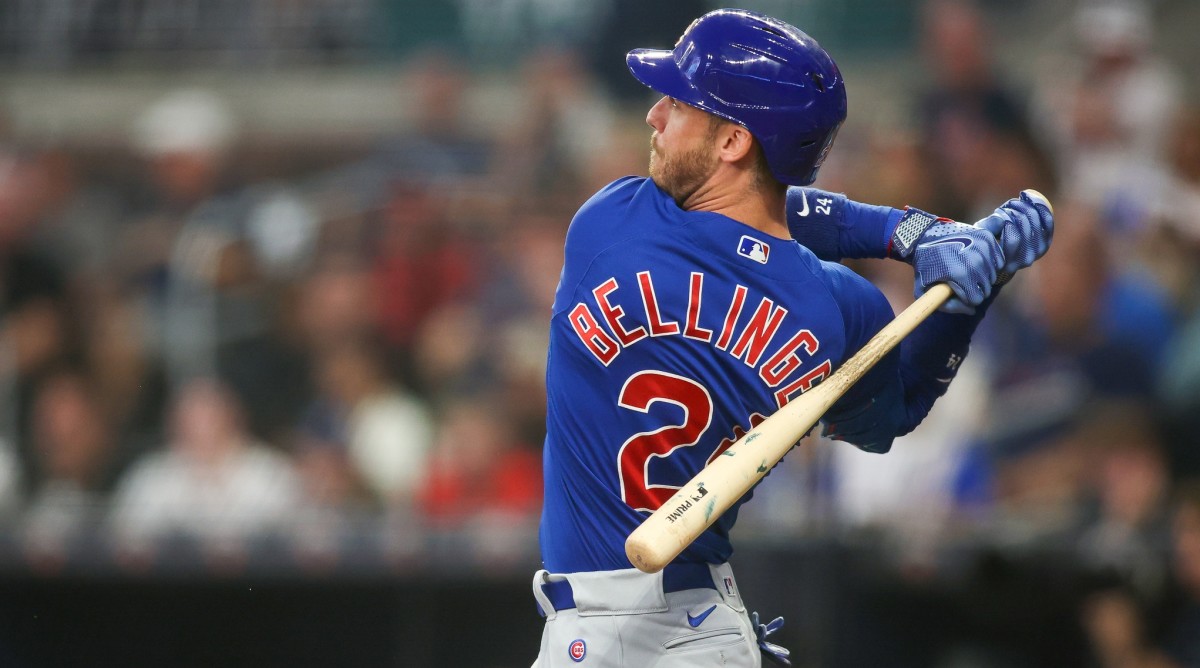 Chicago Cubs first baseman Cody Bellinger (24) hits a single in the second inning of a game against the Atlanta Braves.