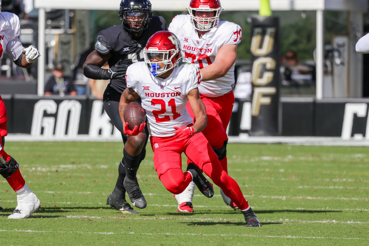 Nov 25, 2023; Orlando, Florida, USA; Houston Cougars running back Stacy Sneed (21) runs the ball during the second quarter against the UCF Knights at FBC Mortgage Stadium. Mandatory Credit: Mike Watters-USA TODAY Sports