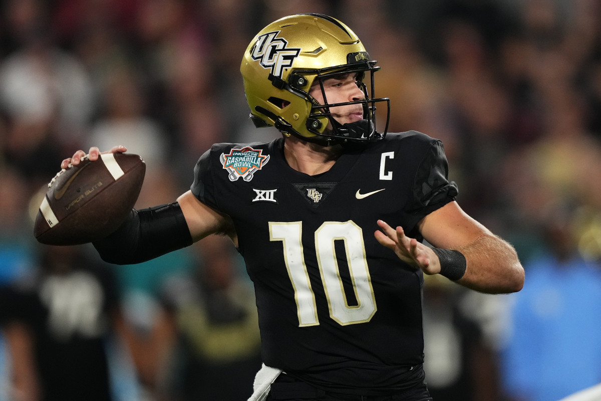 Dec 22, 2023; Tampa, FL, USA; UCF Knights quarterback John Rhys Plumlee (10) attempts a pass against the Georgia Tech Yellow Jackets during the first half of the Gasparilla Bowl at Raymond James Stadium. Mandatory Credit: Jasen Vinlove-USA TODAY Sports