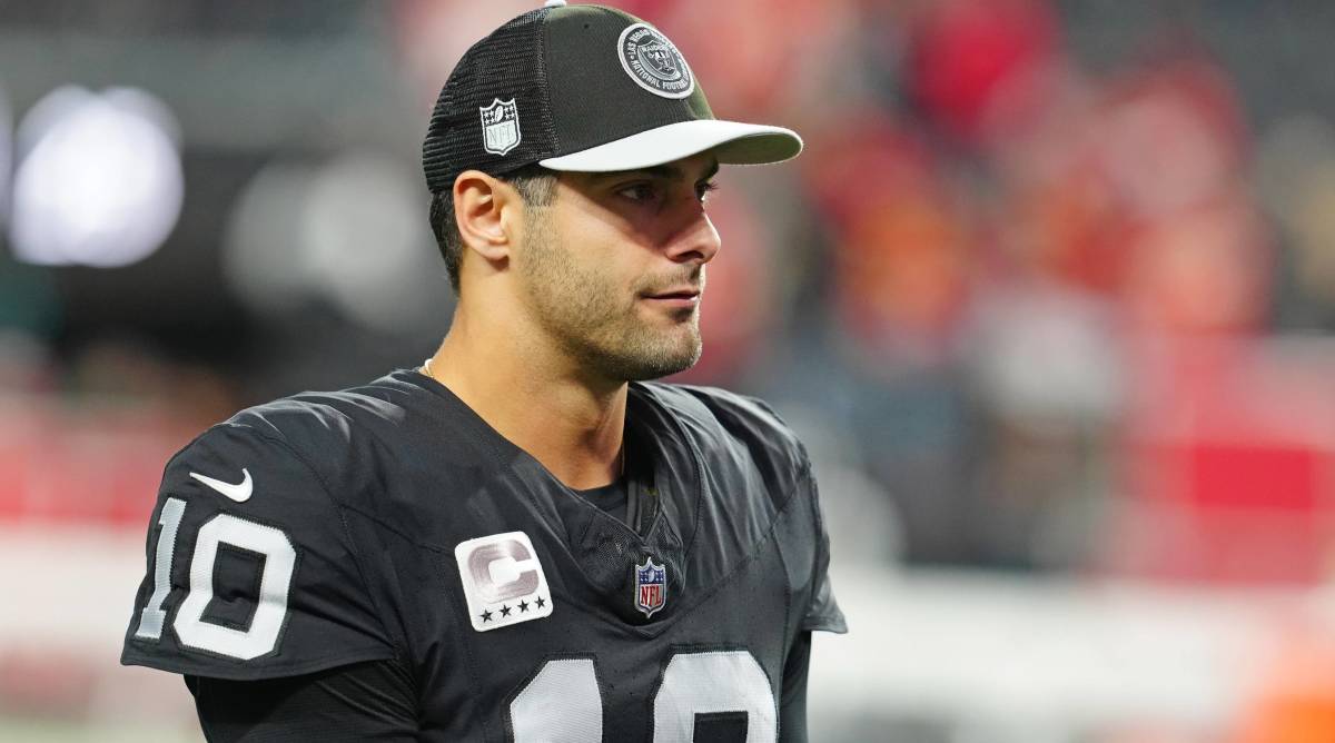 Raiders quarterback Jimmy Garoppolo looks on before a game.