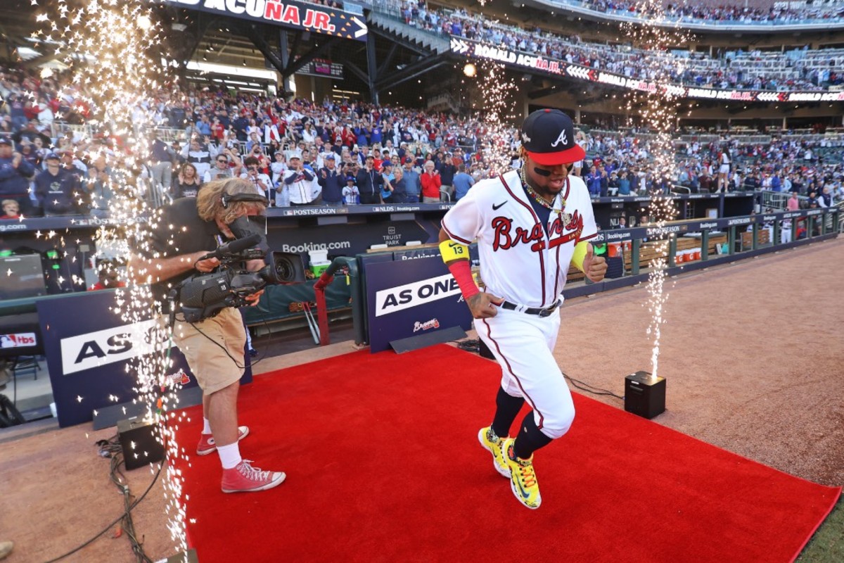 Oct 7, 2023; Cumberland, Georgia, USA; Atlanta Braves right fielder Ronald Acuña Jr. (13) is introduced before playing the Philadelphia Phillies during game one of the NLDS for the 2023 MLB playoffs at Truist Park.