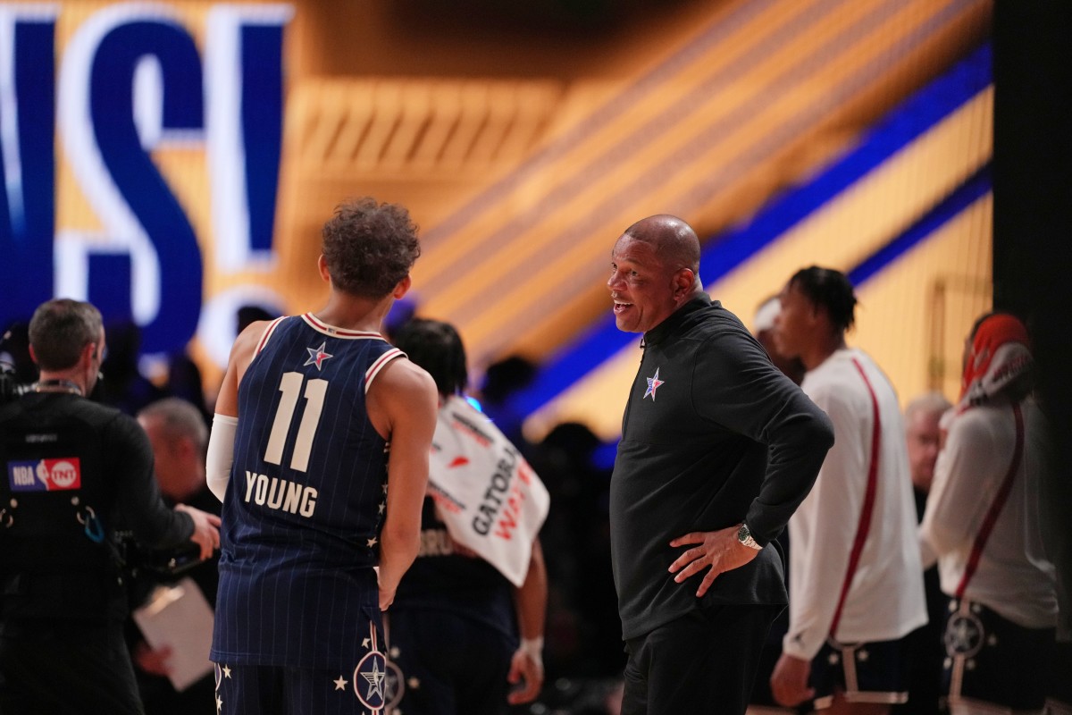 Eastern Conference head coach Doc Rivers of the Milwaukee Bucks talks with guard Trae Young (11) of the Atlanta Hawks during the second half of the 73rd NBA All Star game at Gainbridge Fieldhouse.