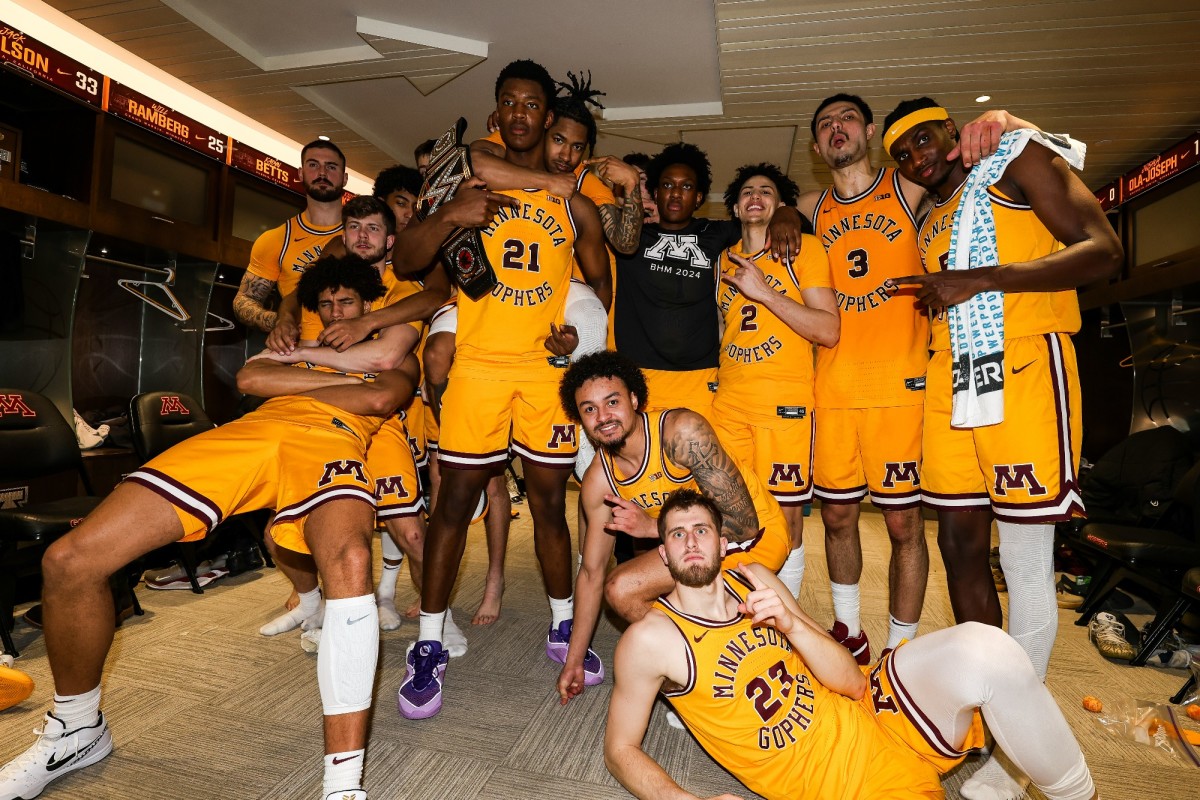 Minnesota poses for a team photo in the locker room after beating Rutgers on Sunday, Feb. 18, 2024.