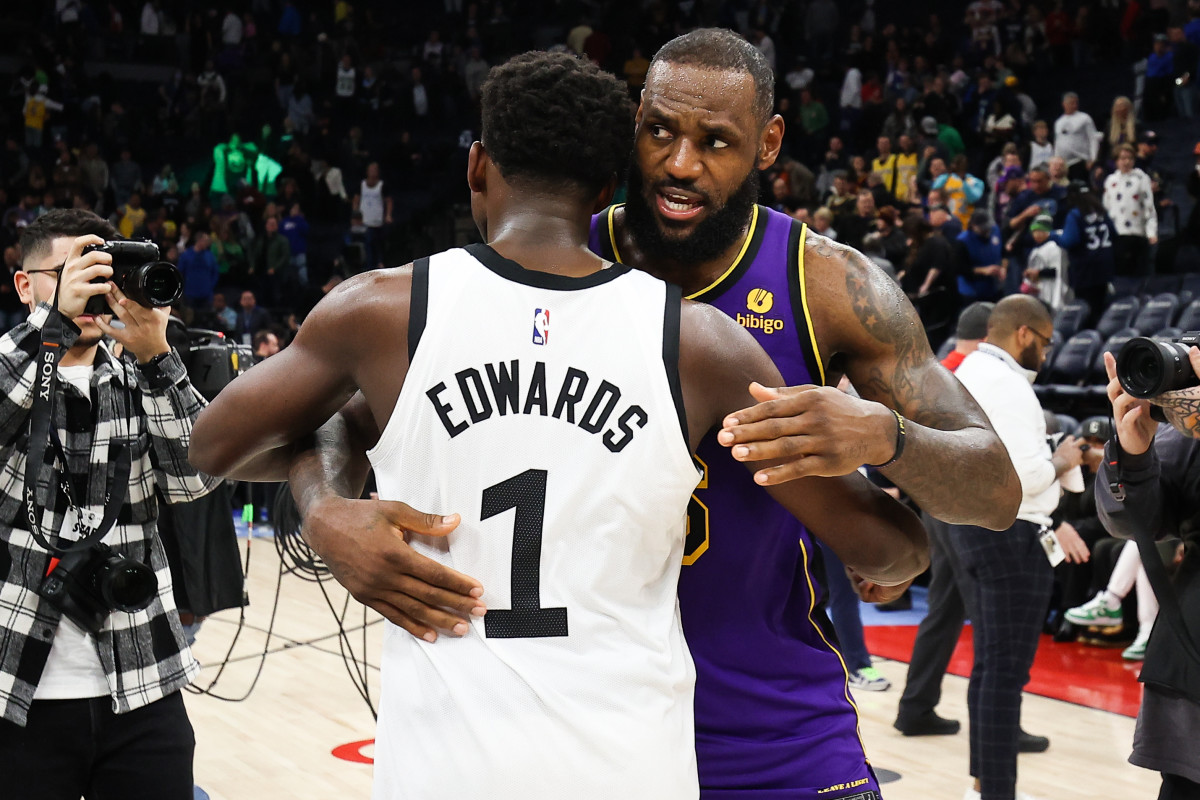 Minnesota Timberwolves guard Anthony Edwards (1) and Los Angeles Lakers forward LeBron James (6) hug after the game at Target Center in Minneapolis on March 31, 2023.