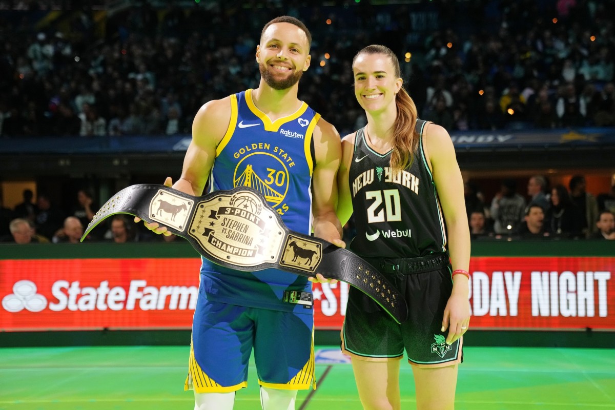 Golden State Warriors guard Stephen Curry (30) and New York Liberty guard Sabrina Ionescu (20) after the Stephen vs Sabrina three-point challenge during NBA All-Star Saturday at Lucas Oil Stadium in Indianapolis on Feb. 17, 2024.