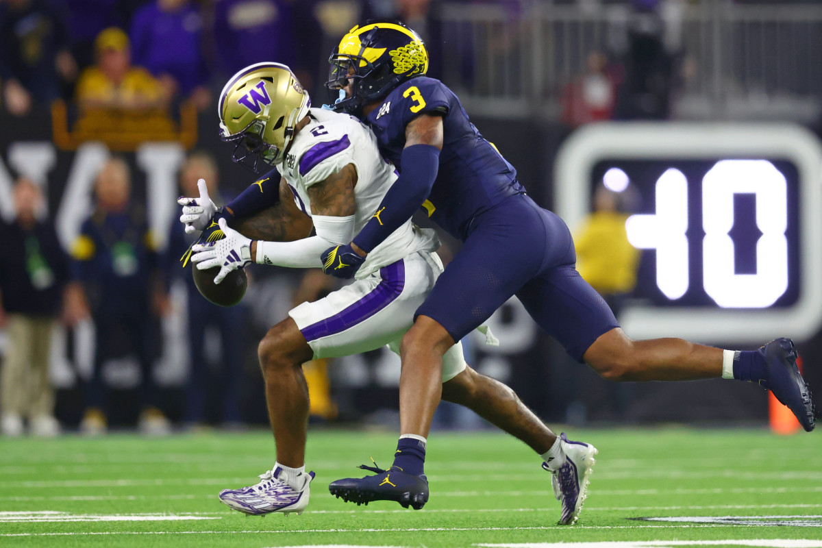 Michigan Wolverines safety Keon Sabb (3) breaks up a pass intended for Washington Huskies wide receiver Ja'Lynn Polk during the 2024 National Championship in New Orleans.