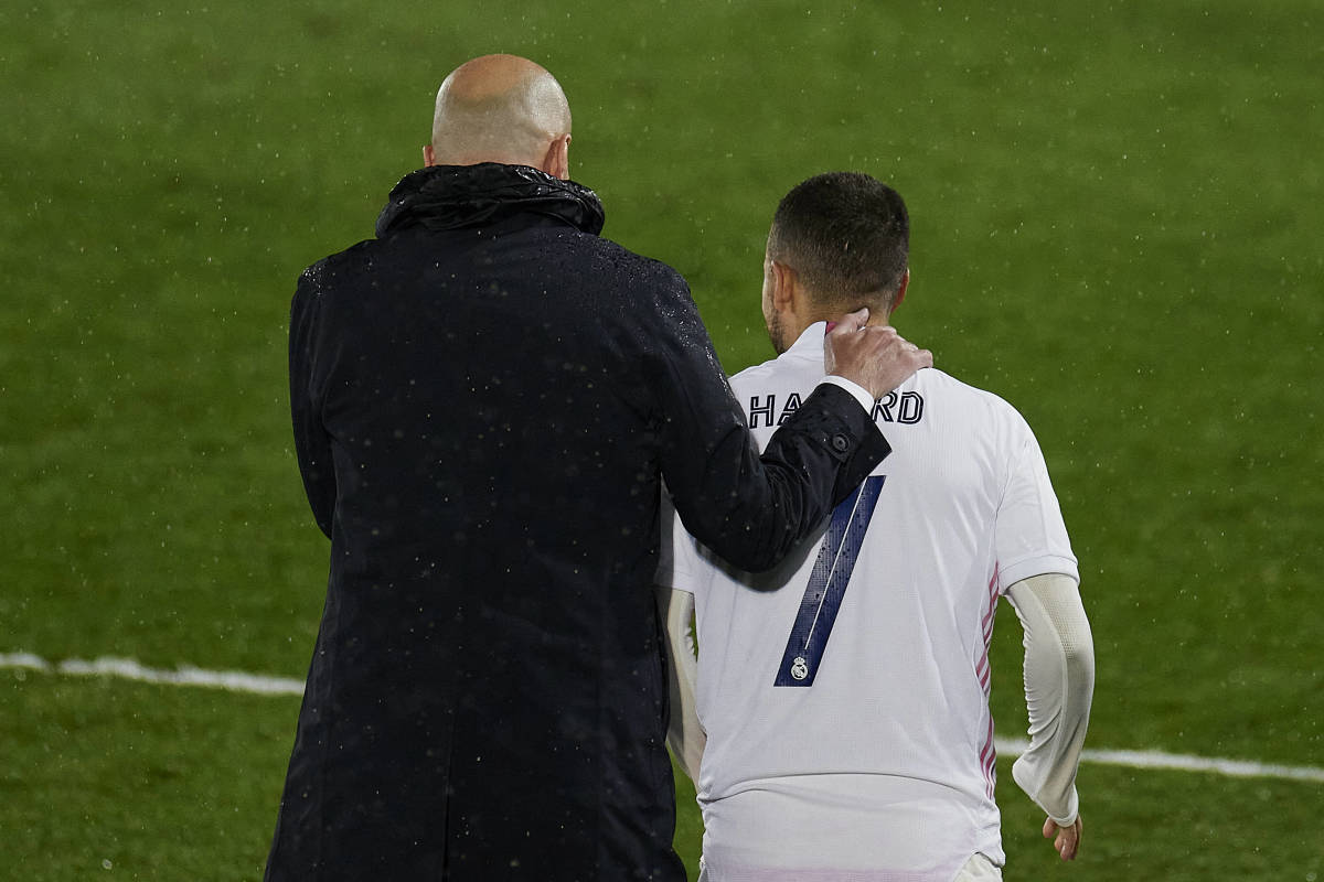 Manager Zinedine Zidane pictured (left) with his arm around Eden Hazard during a UEFA Champions League game between Real Madrid and Chelsea in April 2021