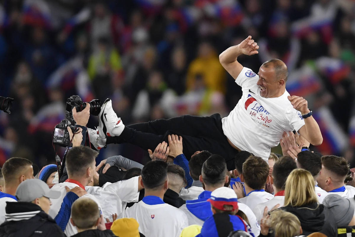 Slovakia manager Francesco Calzona pictured celebrating with his team in November 2023 after they qualified for Euro 2024