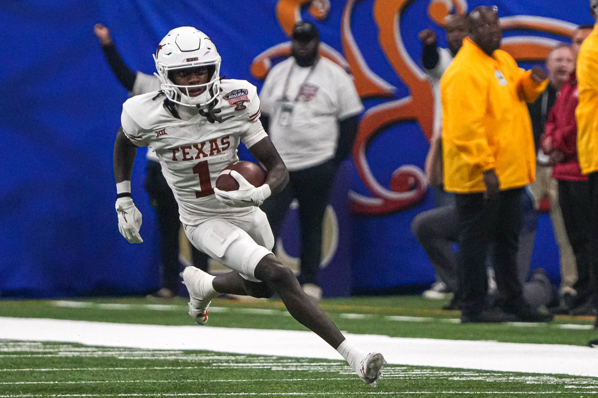 Texas Longhorns wide receiver Xavier Worthy (1) runs the ball during the Sugar Bowl College Football Playoff semifinals game against the Washington Huskies at the Caesars Superdome on Monday, Jan. 1, 2024 in New Orleans, Louisiana.  