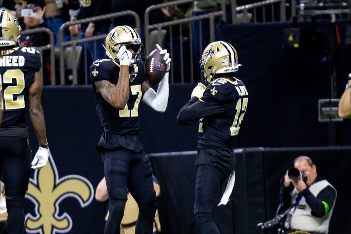 New Orleans Saints wide receiver A.T. Perry (17) celebrates a touchdown with wide receiver Chris Olave (12)