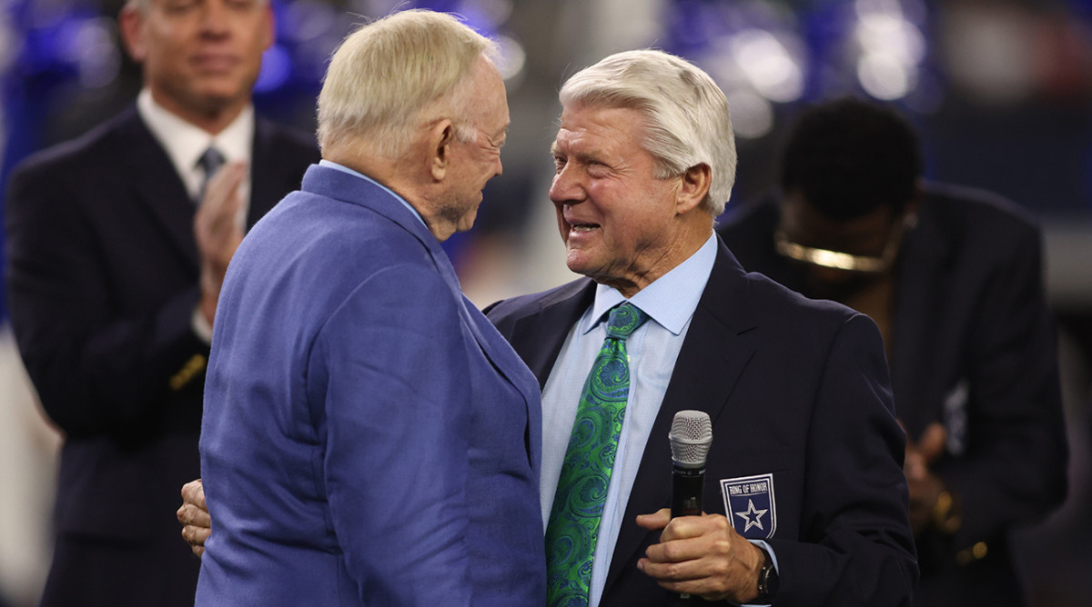 Dallas Cowboys owner Jerry Jones talks to former coach Jimmy Johnson during the Ring of Honor ceremony during half of the game against the Detroit Lions at AT&T Stadium.