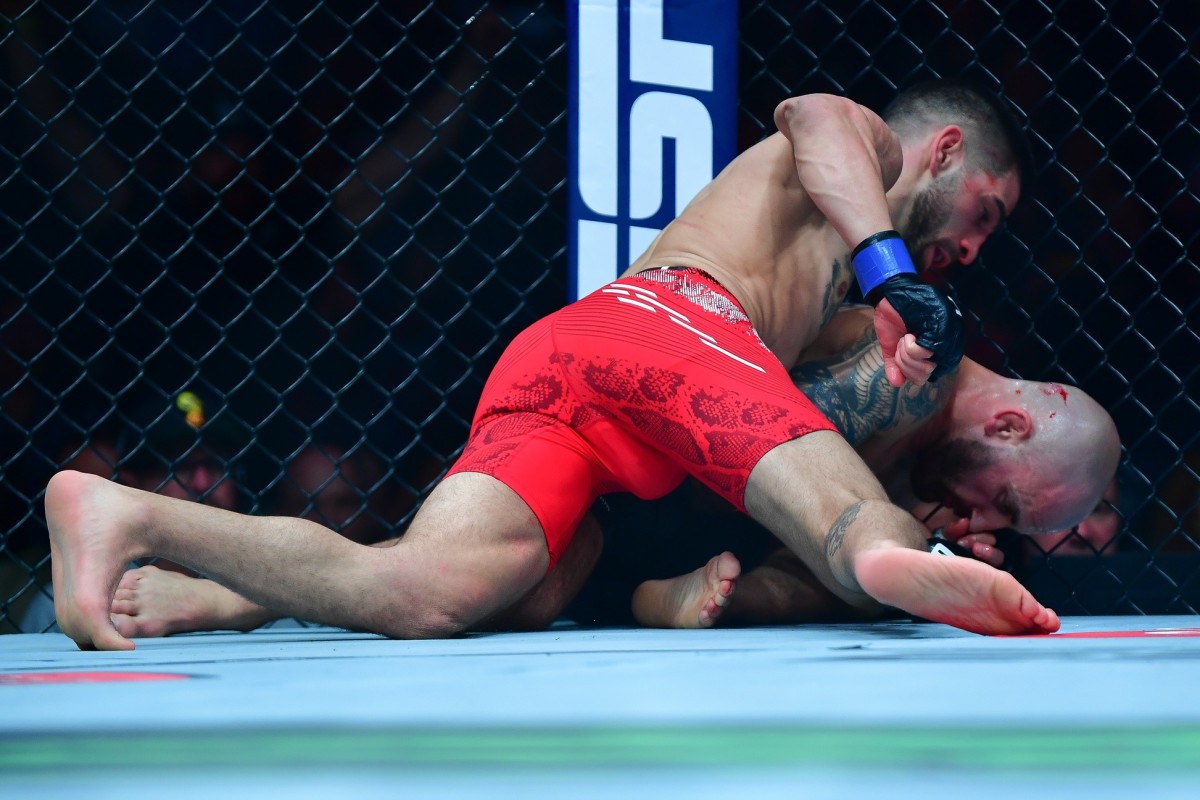 Ilia Topuria lands hits against Alexander Volkanovski for his KO victory during UFC 298