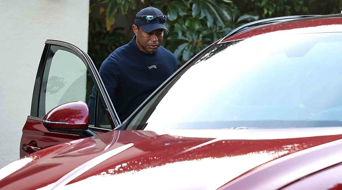 Tiger Woods leaves from the clubhouse after withdrawing from the 2024 Genesis Invitational due to illness during the second round at Riviera Country Club.
