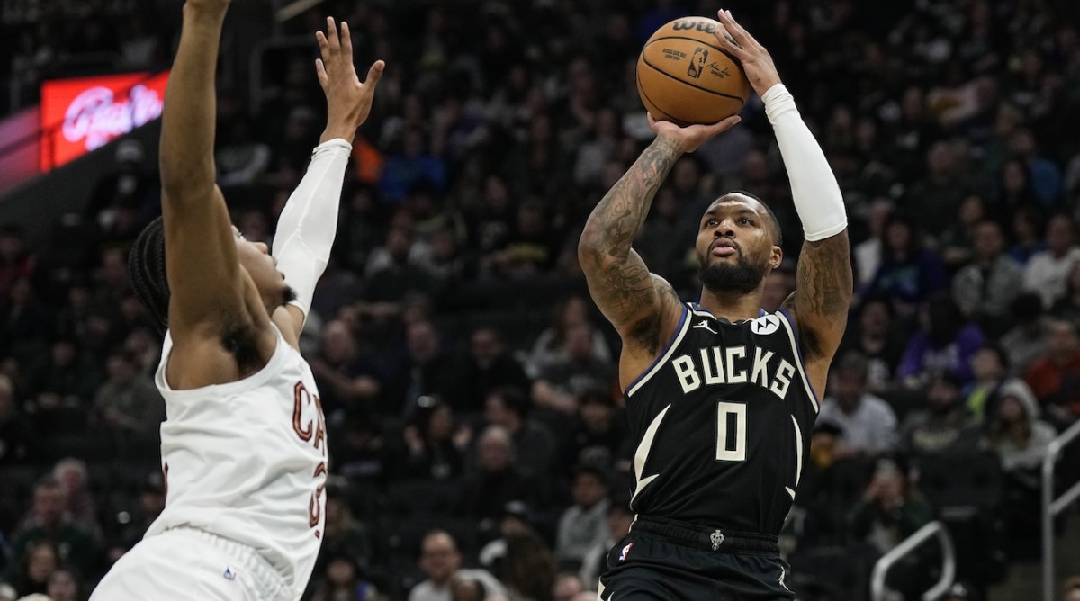 Milwaukee Bucks guard Damian Lillard (0) shoots during the first quarter against the Cleveland Cavaliers at Fiserv Forum in Milwaukee, Wisconsin, on Jan. 26, 2024.