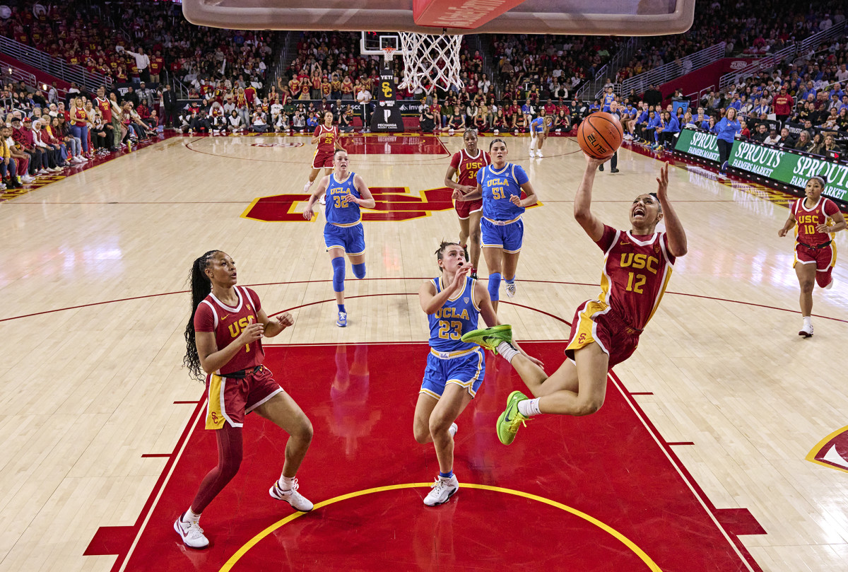USC Trojans guard JuJu Watkins drives to the basket against UCLA.
