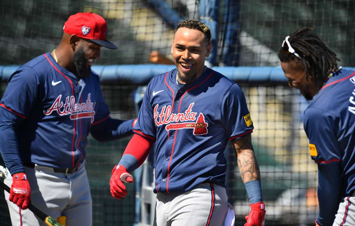 Atlanta Braves players, from left, Marcell Ozuna, Orlando Arcia and Ronald Acuna, Jr. joke around during batting practice Tuesday, Feb. 20, 2024 at CoolToday Park in North Port, Florida.  