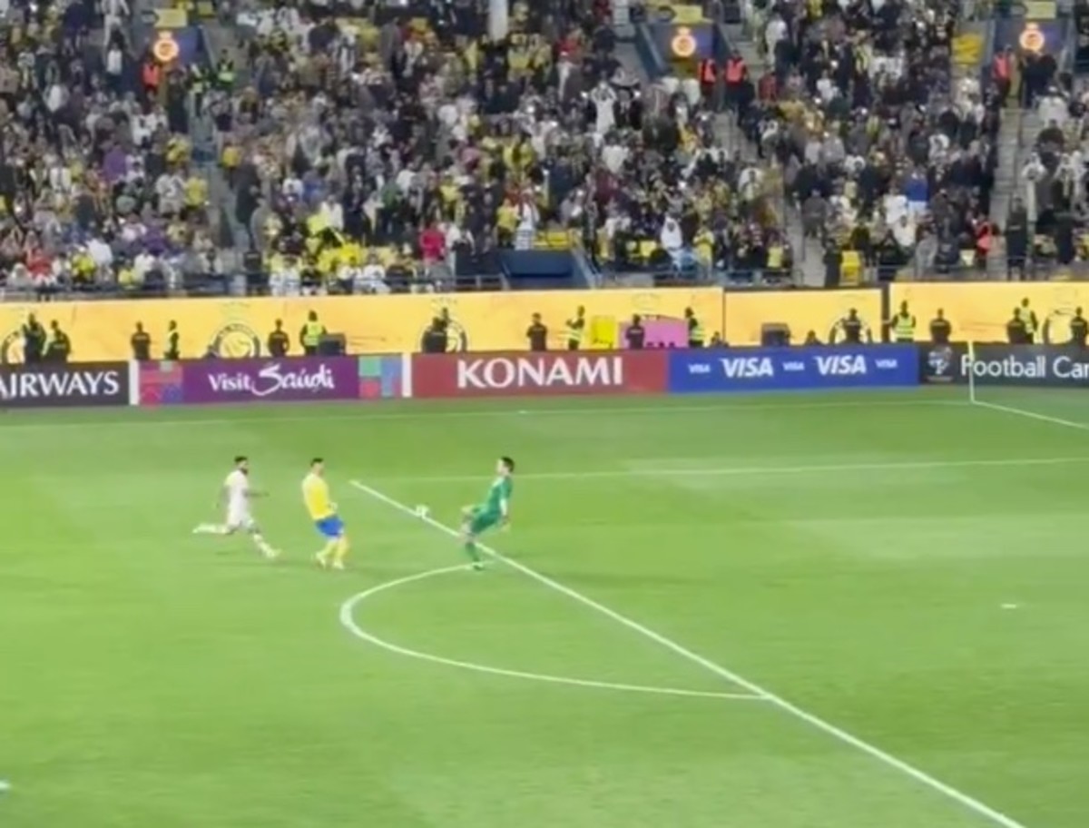 Cristiano Ronaldo pictured (center) moments before he punished an error by goalkeeper Vladimir Stojkovic (right) to score for Al Nassr in a 2-0 win over Al Feiha in the AFC Champions League in February 2024
