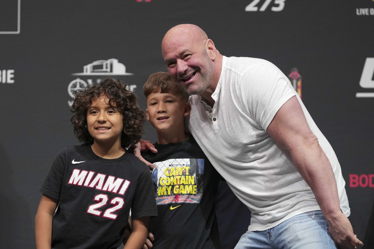 Apr 8, 2022; Jacksonville, FL, USA; Dana White (white shirt) with some young fans during weigh-ins for UFC 273 at VyStar Veterans Memorial Stadium.