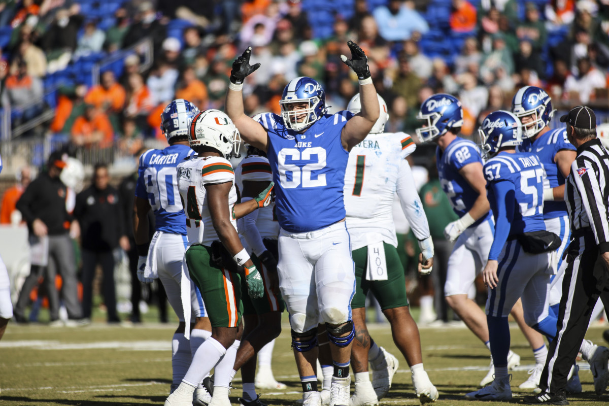 Nov 27, 2021; Durham, North Carolina, USA; Duke Blue Devils offensive tackle Graham Barton (62) celebrates a point during the first half of the game against the Miami Hurricanes at Wallace Wade Stadium. at Wallace Wade Stadium. Mandatory Credit: Jaylynn Nash-USA TODAY Sports