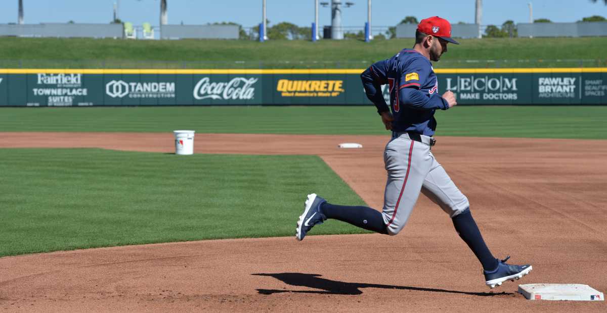 Atlanta Braves outfielder Forrest Wall (#73) steps on first base during a baserunning drill at practice Tuesday, Feb. 20, 2024 at CoolToday Park in North Port, Florida.  