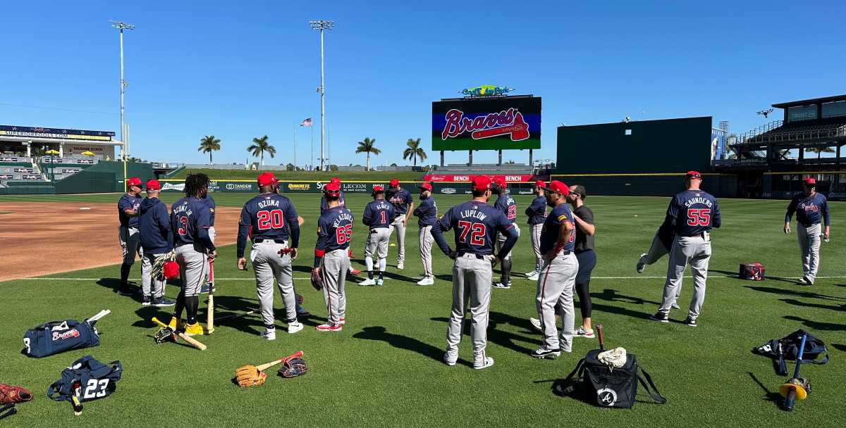 Atlanta Braves gather on the field before starting their spring training workout on Tuesday, Feb. 20, 2024 at CoolToday Park in North Port, Florida.  