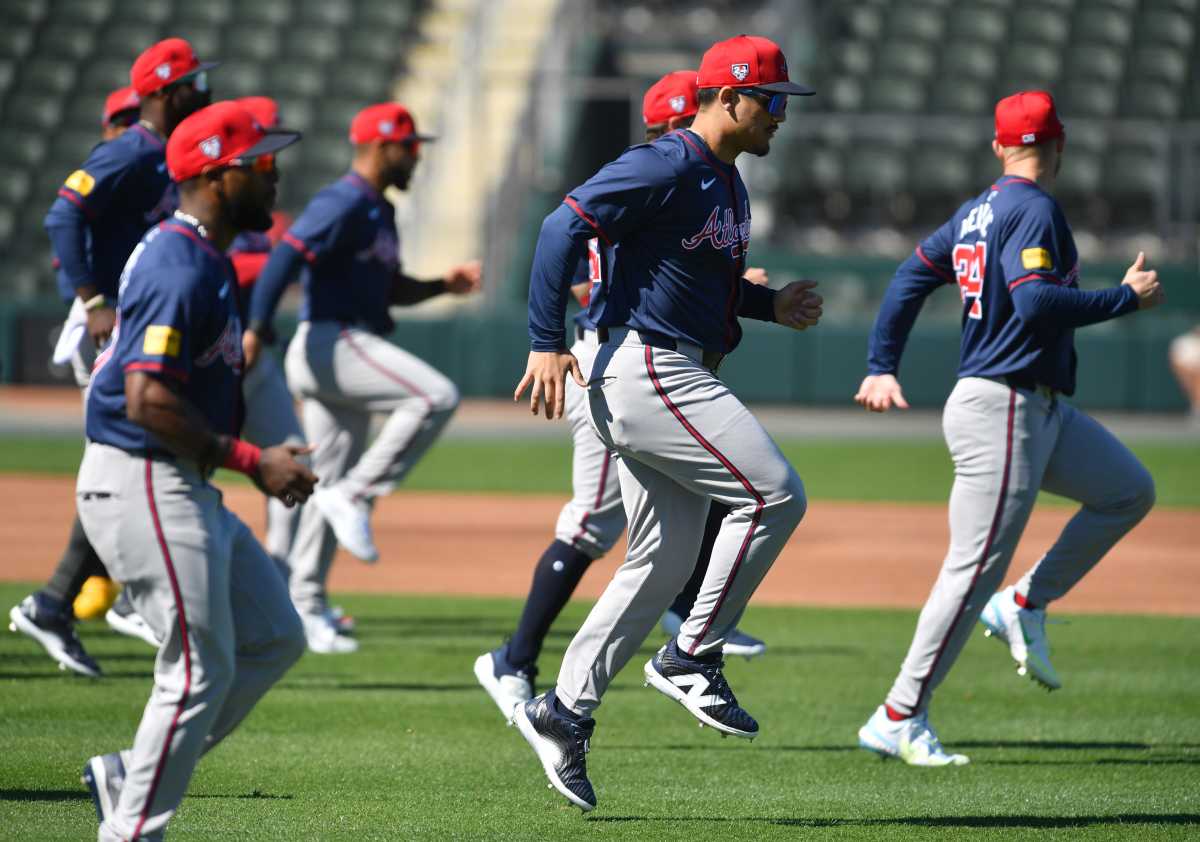 Atlanta Braves players do exercised to get warmed up at the start of spring training practice on Tuesday, Feb. 20, 2024 at CoolToday Park in North Port, Florida.  