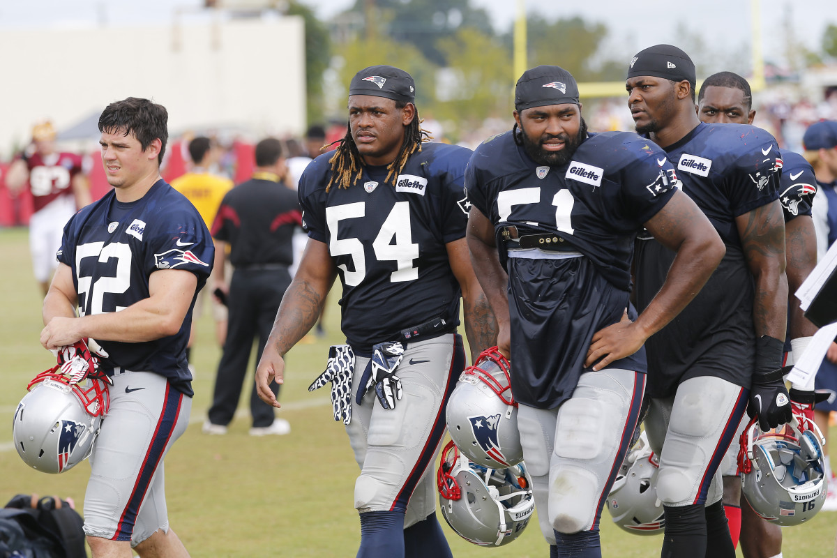Aug 4, 2014; Richmond, VA, USA; New England Patriots linebacker James Morris (52), Patriots outside linebacker Dont'a Hightower (54), and Patriots outside linebacker Jerod Mayo (51) leave the field after joint practice with the New England Patriots on day ten of training camp at the Bon Secours Washington Redskins Training Center.