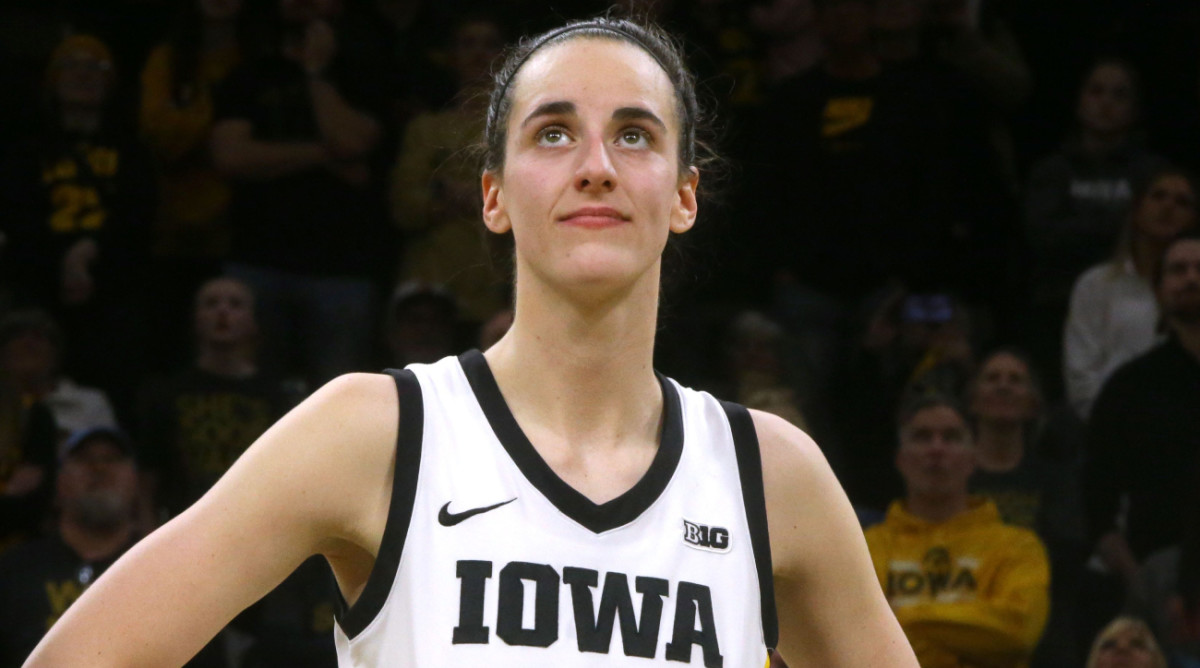 Iowa’s Caitlin Clark reacts to a video about her career after she broke the NCAA Division I women’s basketball scoring record.