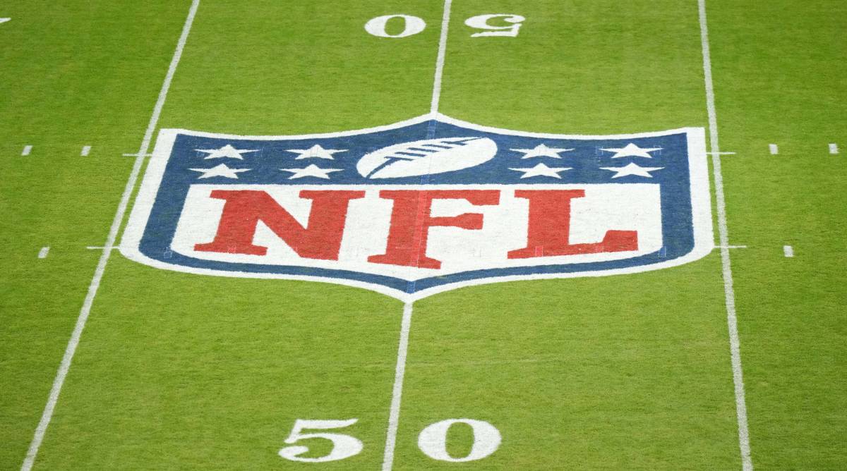 The NFL Logo at midfield before a game.