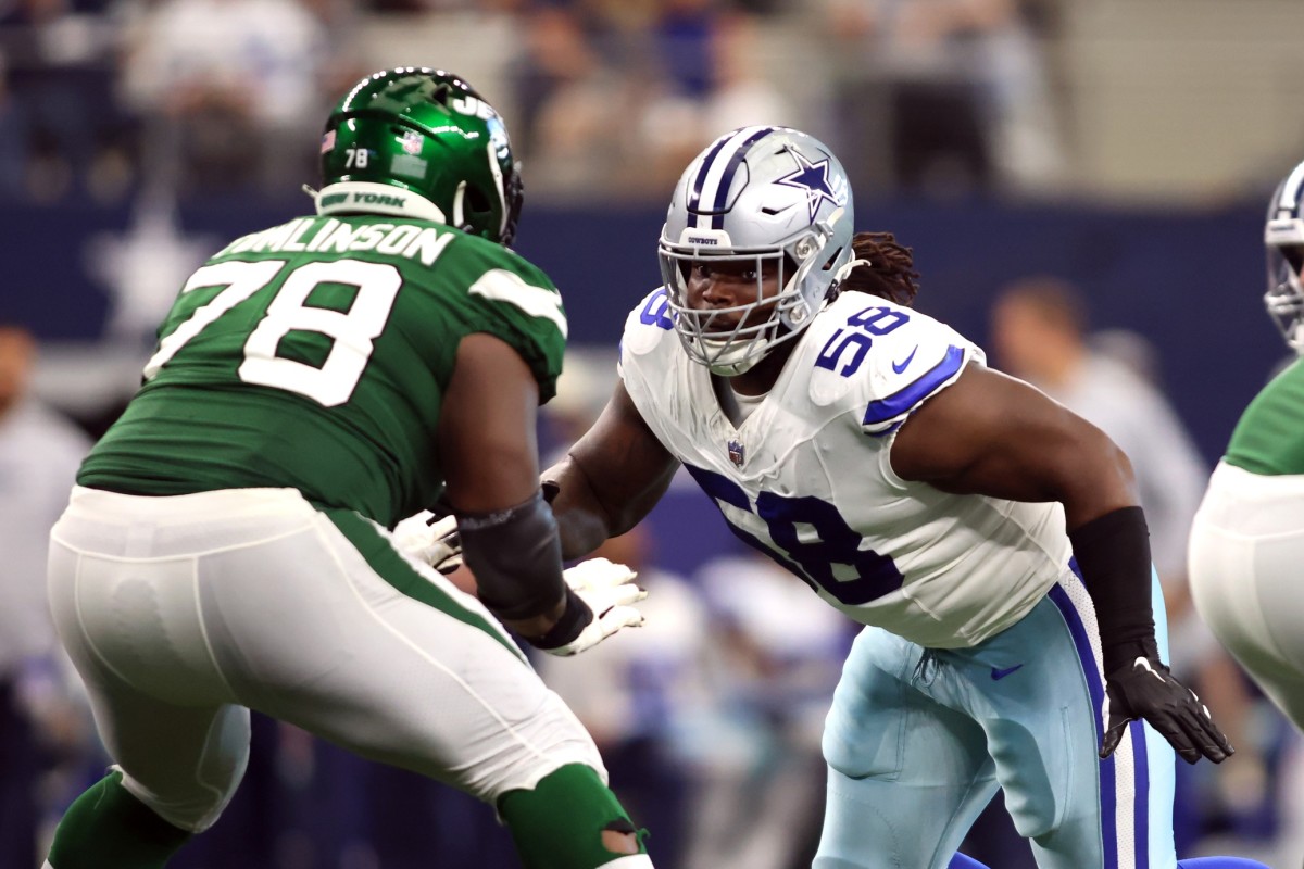 Sep 17, 2023; Arlington, Texas, USA; Dallas Cowboys defensive tackle Mazi Smith (58) rushes the passer while blocked by New York Jets guard Laken Tomlinson (78) in the third quarter at AT&T Stadium.