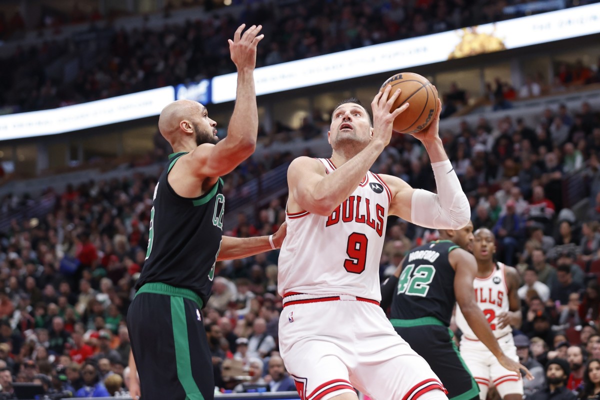  Chicago Bulls center Nikola Vucevic (9) goes to the basket against the Boston Celtics during the first half at United Center.