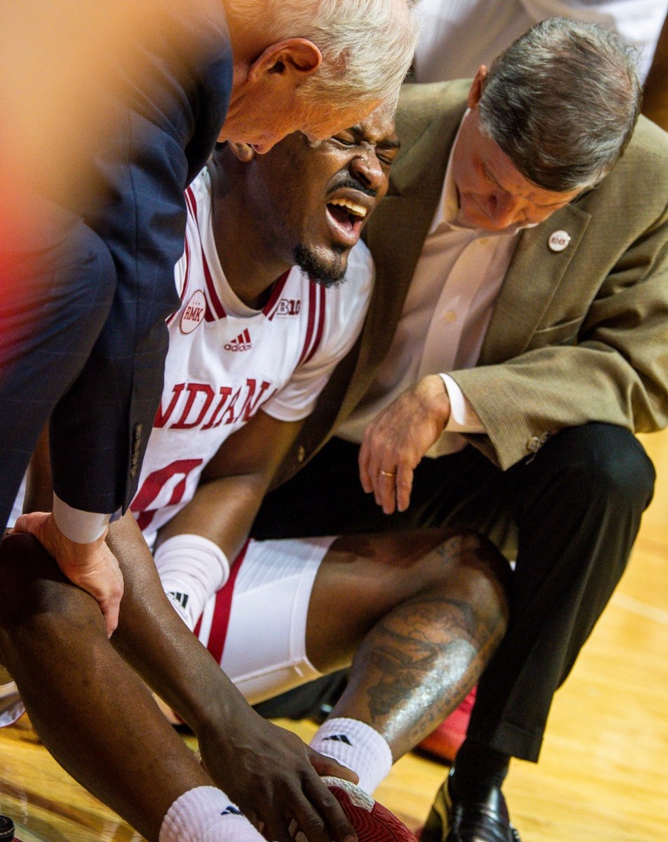 Indiana's Xavier Johnson (0) winces in pain after being injured during the second half of the Indiana versus Iowa men's basketball game at Simon Skjodt Assembly Hall on Tuesday, Jan. 30, 2024. Rich Janzaruk/Herald Times / USA TODAY NETWORK