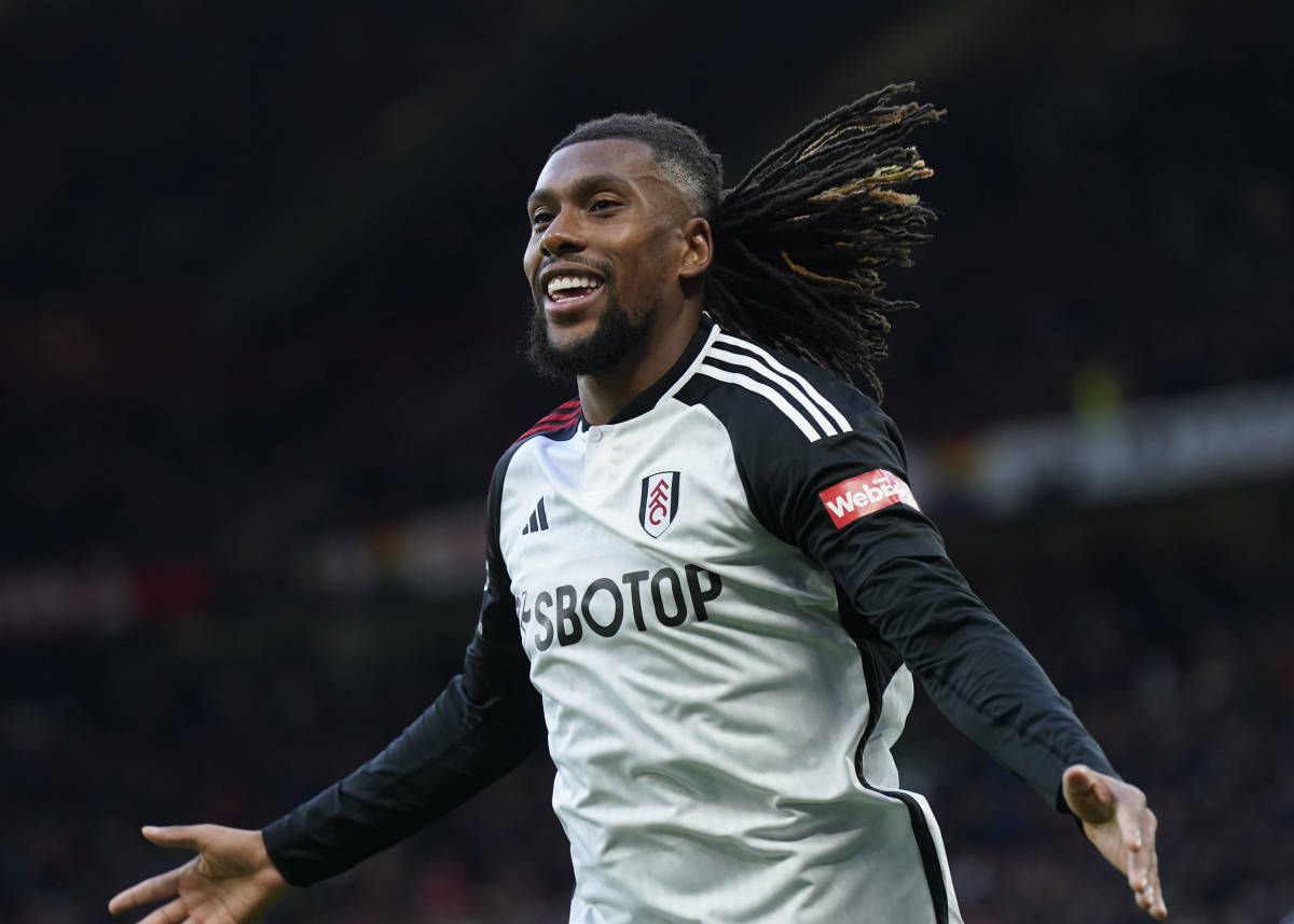 Alex Iwobi pictured celebrating after scoring a late winning goal for Fulham in a 2-1 victory at Manchester United in February 2024