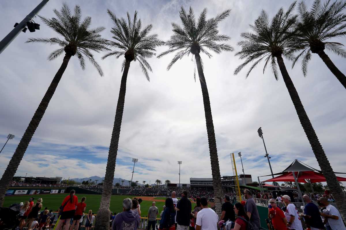 Baseball fans walk the concourse of Goodyear Ballpark before the the inning during a MLB spring training baseball game between the Cleveland Guardians and the Cincinnati Reds, Saturday, Feb. 24, 2024, at Goodyear Ballpark in Goodyear, Ariz.