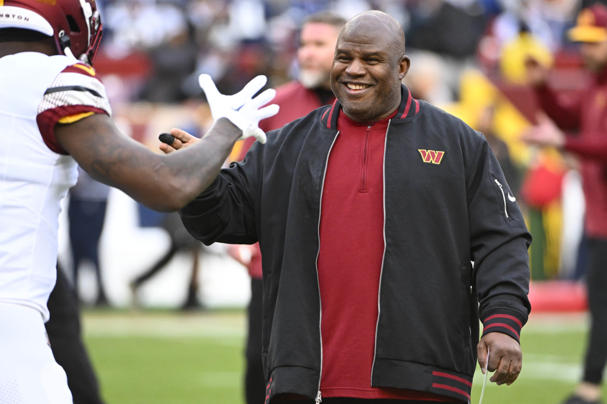 Washington Commanders offensive coordinator Eric Bieniemy on the field before the game against the Dallas Cowboys at FedExField