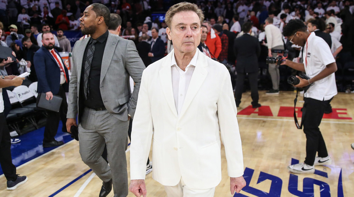 Red Storm coach Rick Pitino walks off the court after defeating the Creighton Bluejays.