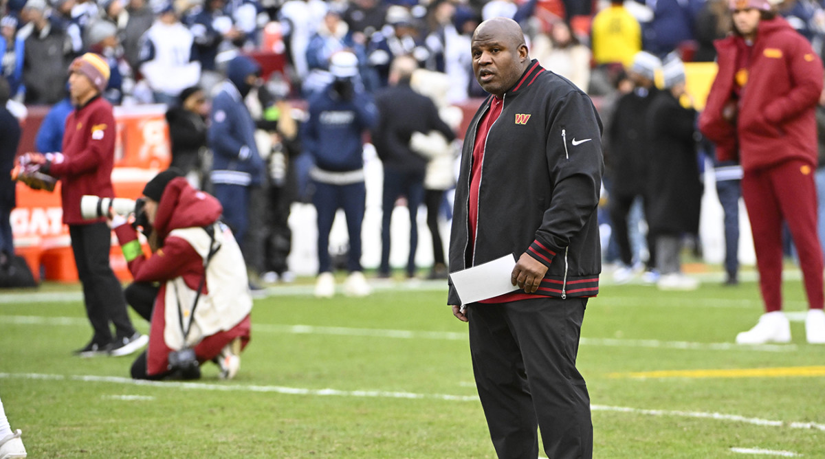 Washington Commanders offensive coordinator Eric Bieniemy on the field before the game against the Dallas Cowboys at FedExField.