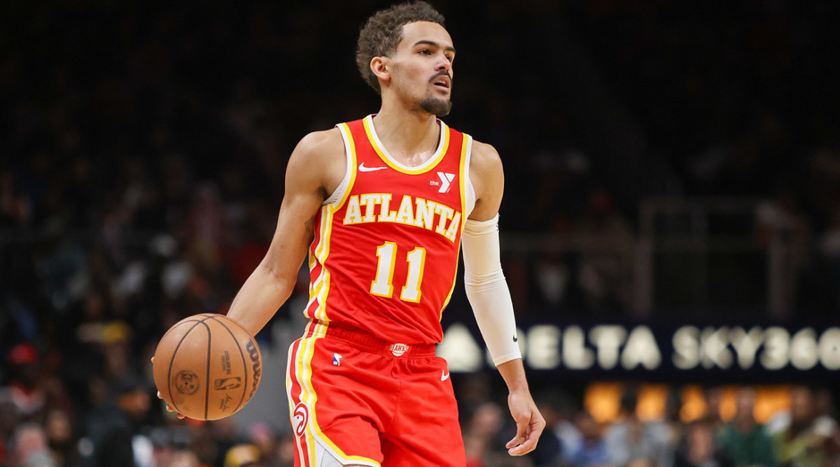 Hawks guard Trae Young handles the ball against the Houston Rockets.