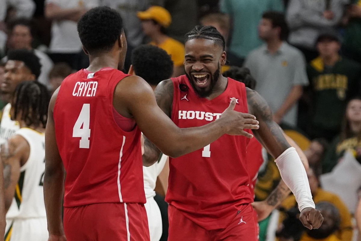 Houston Cougars guard L.J. Cryer (4) and guard Jamal Shead (1) react in the closing moments of overtime against the Baylor Bears at Paul and Alejandra Foster Pavilion.
