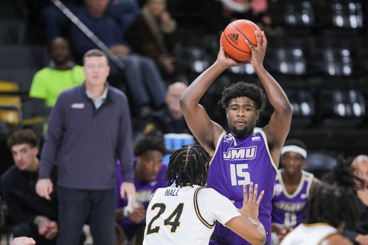 James Madison Dukes forward Jaylen Carey (15) looks to pass over Southern Miss Golden Eagles forward Bryson Hall (24) during the second half at Reed Green Coliseum in Hattiesburg, Mississippi, on Jan. 6, 2024.
