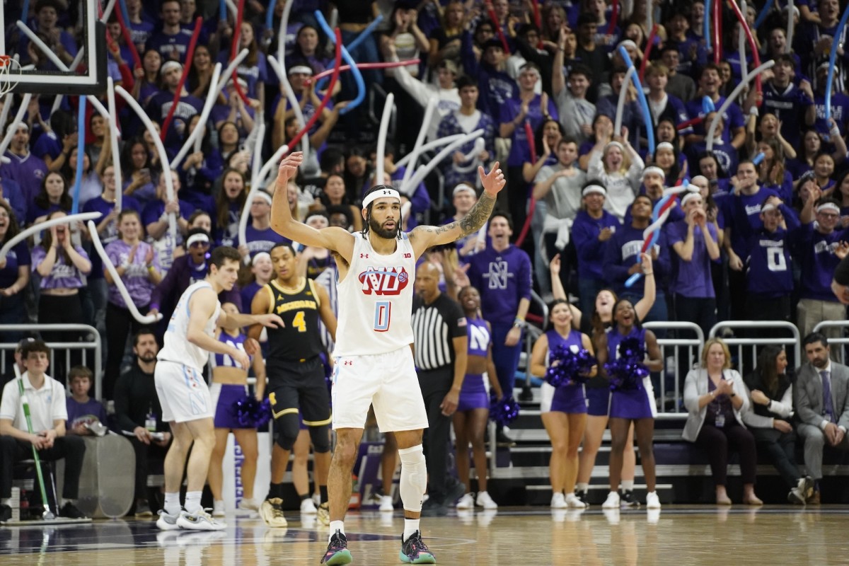 Northwestern Wildcats guard Boo Buie (0) gestures after making a three point basket against the Michigan Wolverines during the first half at Welsh-Ryan Arena in Evanston, Illinois, on Feb. 22, 2024.