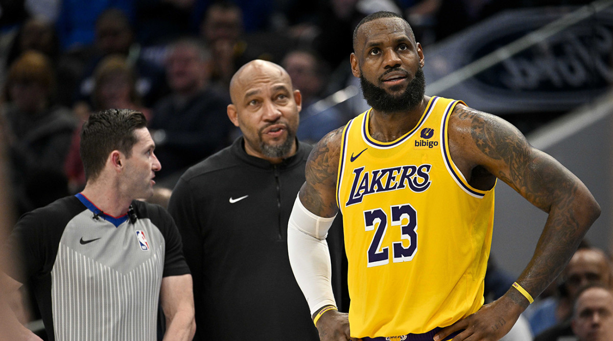 Lakers coach Darvin Ham and forward LeBron James (23) during a game against the Dallas Mavericks at the American Airlines Center.