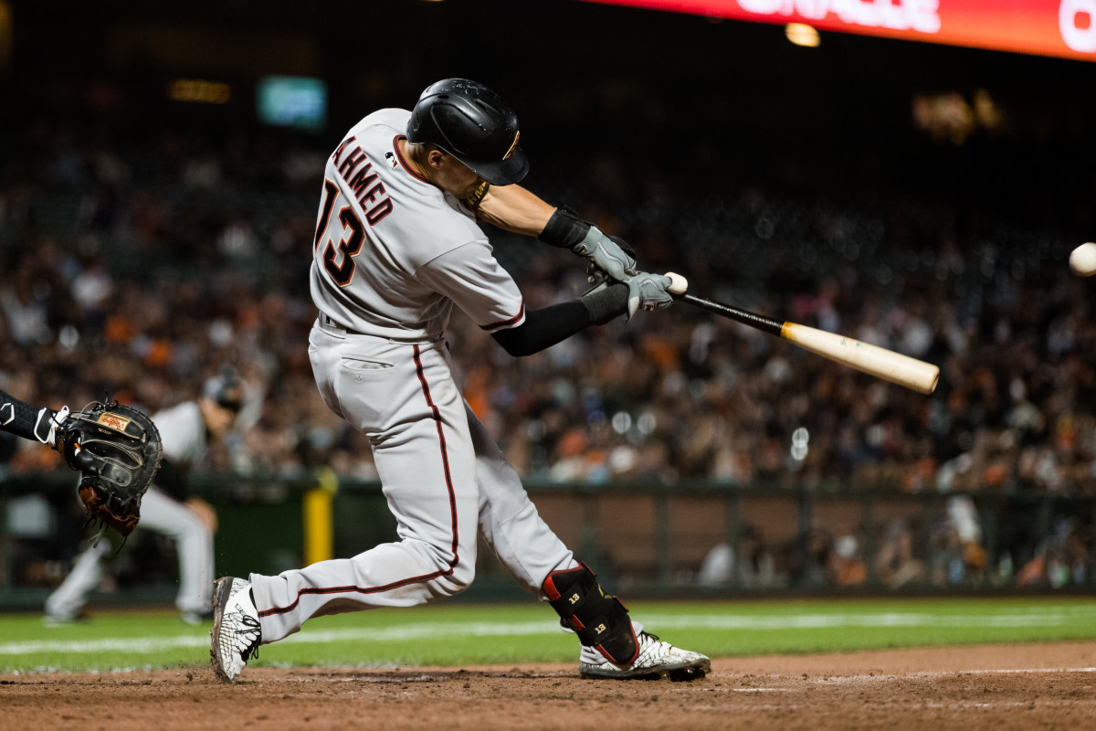 Arizona Diamondbacks shortstop Nick Ahmed hits an RBI single against the SF Giants. (2021)