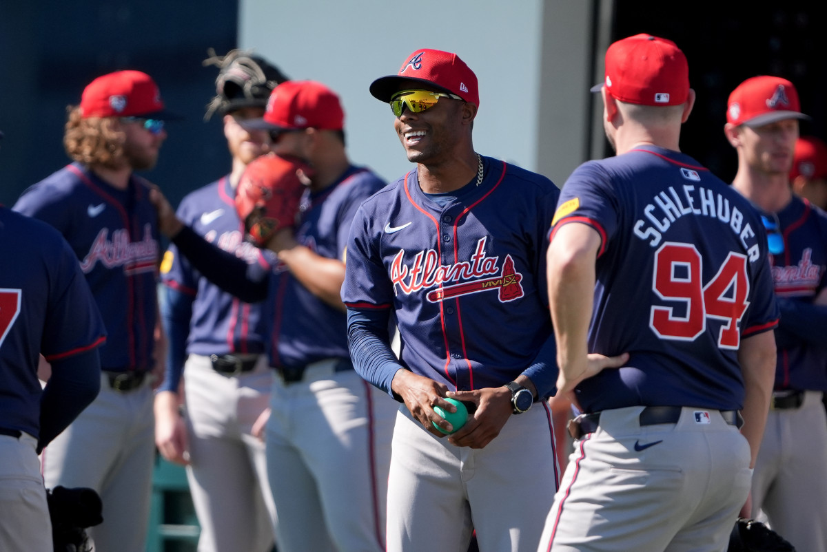 Feb 15, 2024; North Port, FL, USA; Atlanta Braves relief pitcher Raisel Iglesias (26) talks with other pitchers at the Braves Spring Training practice at CoolToday Park.
