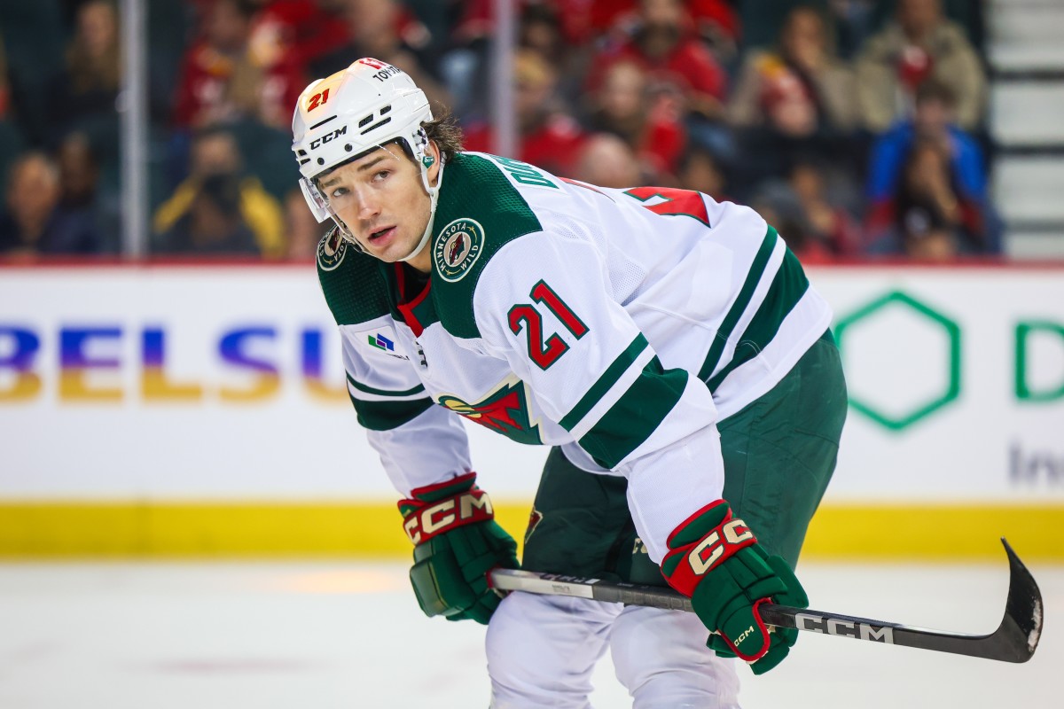 Dec 5, 2023; Calgary, Alberta, CAN; Minnesota Wild right wing Brandon Duhaime (21) against the Calgary Flames during the first period at Scotiabank Saddledome.