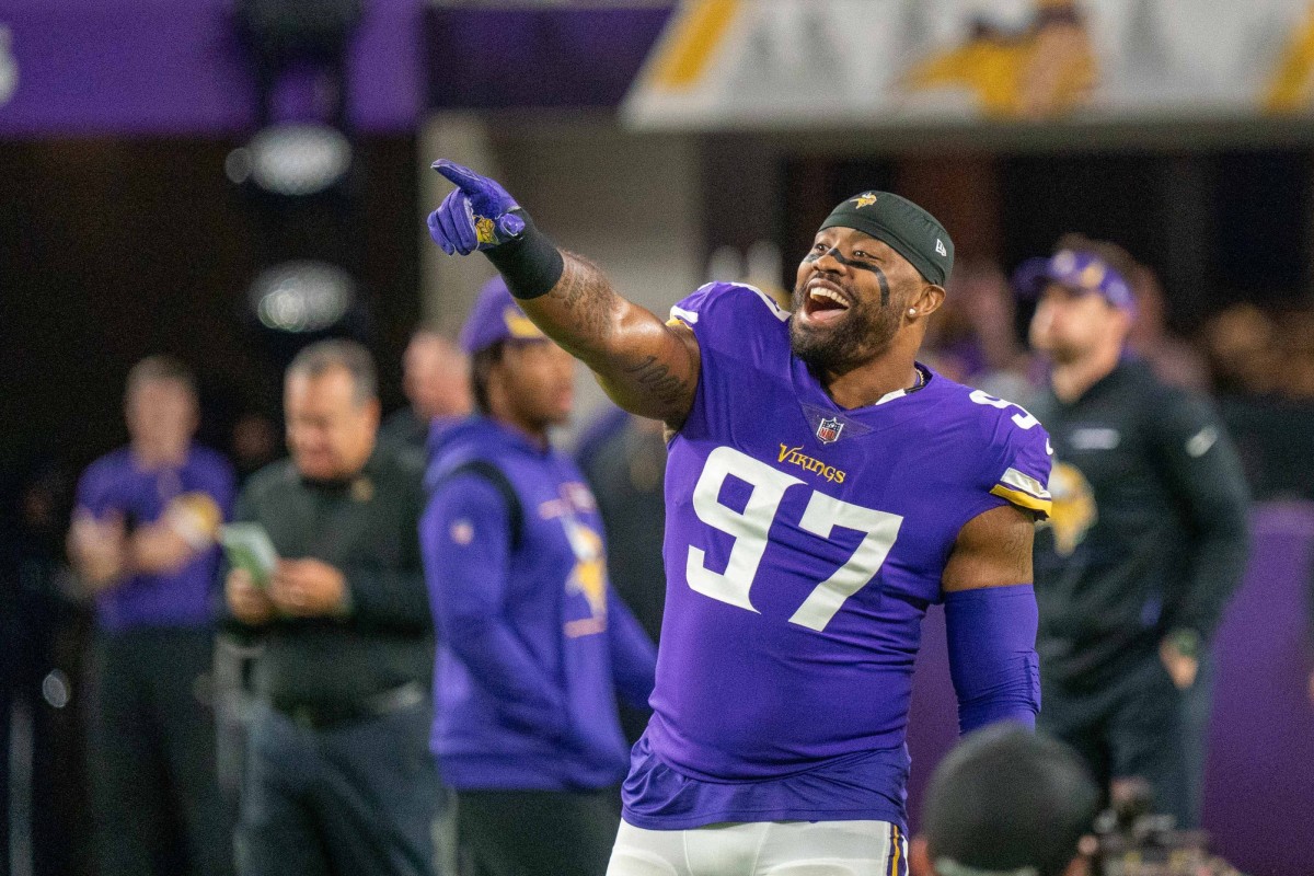Oct 31, 2021; Minneapolis, Minnesota, USA; Minnesota Vikings defensive end Everson Griffen (97) greets a member of the Dallas Cowboys during before the teams meet at U.S. Bank Stadium.