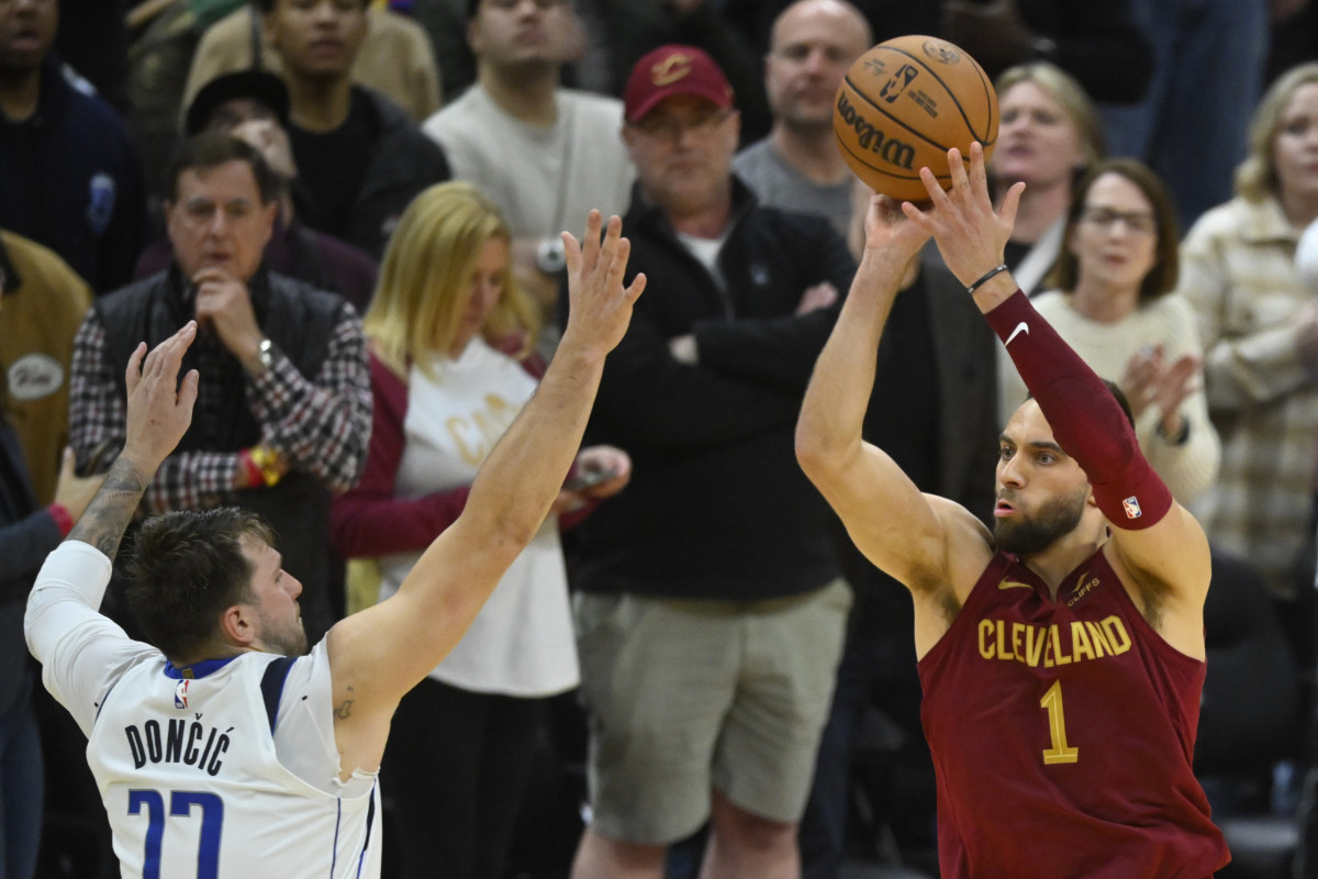 Feb 27, 2024; Cleveland, Ohio, USA; Cleveland Cavaliers guard Max Strus (1) makes a last-second, game-winning three-point basket beside Dallas Mavericks guard Luka Doncic (77) in the fourth quarter against at Rocket Mortgage FieldHouse.